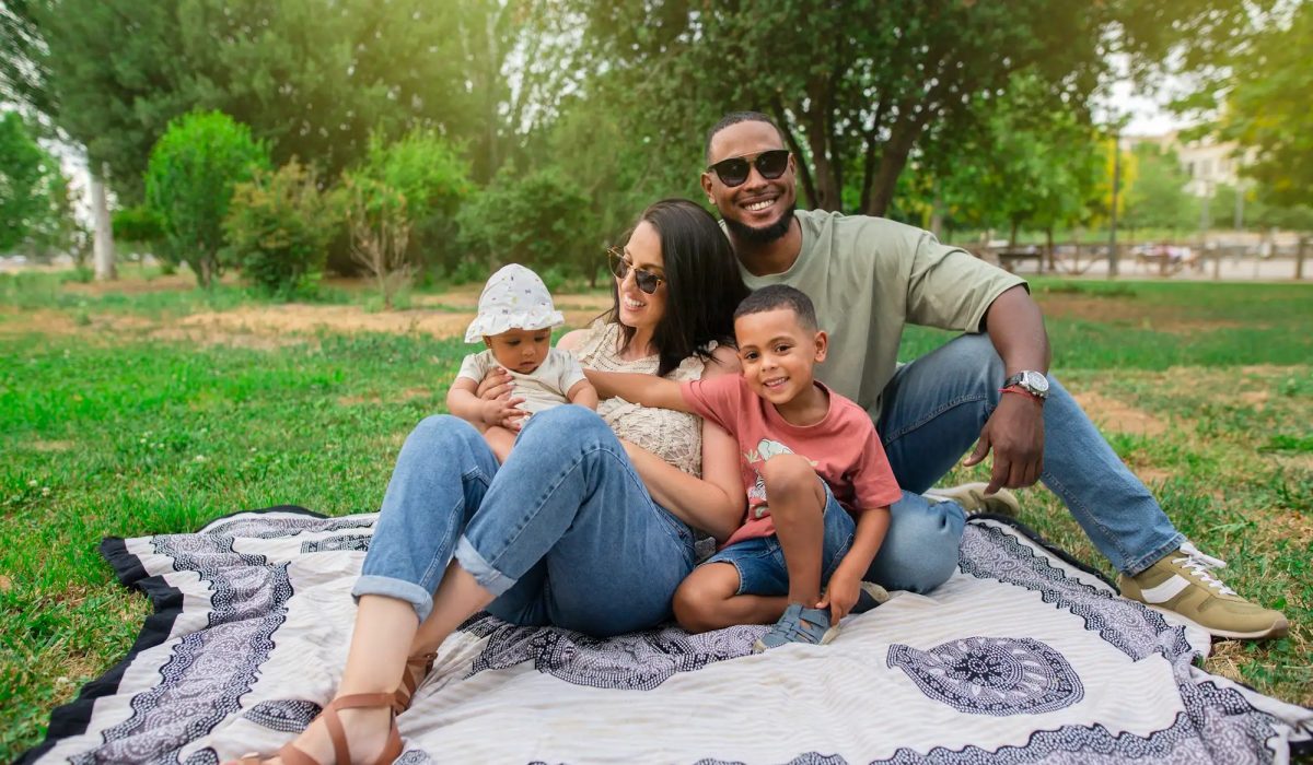 Happy family spanish-latin with their children in the park